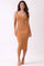 woman wearing a fitted ribbed midi dress in a warm caramel color with a v-neckline and spaghetti straps