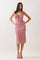 woman wearing a pink floral slip dress with adjustable straps and a fitted silhouette