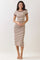 woman wearing a cream and brown striped midi dress with short sleeves and a fitted silhouette