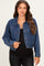 woman wearing a dark blue denim maternity jacket with polka dots over a black top