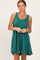 woman wearing a green ribbed sleeveless dress with a fitted bodice and flared skirt