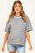 woman wearing a gray and blue striped maternity t-shirt with short sleeves and relaxed fit, paired with denim shorts