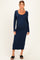 woman wearing a navy long sleeve ribbed maternity dress and showing her baby bump