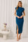woman wearing a teal ribbed midi dress with cap sleeves and a side slit, standing against a neutral backdrop
