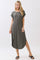 woman wearing a relaxed fit olive green t-shirt dress with short sleeves and side slits