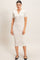woman wearing a fitted white checkered midi dress with short sleeves and a collar