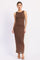woman wearing a sleeveless brown lace maxi dress with a fitted silhouette and a round neckline