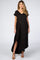 woman wearing a black short sleeve v-neck maternity maxi dress with side slits and brown sandals