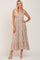 woman wearing a floral maxi dress with square neckline and tie shoulder straps