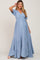 woman wearing a light blue tiered maternity dress with a v-neckline and short sleeves, showcasing her baby bump