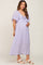woman wearing a lavender maternity maxi dress with tie front and flutter sleeves, showcasing her baby bump