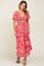 woman wearing a red floral print maxi dress with flutter sleeves and a twist front detail