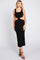 woman wearing a black cut-out midi dress with a fitted silhouette and tank straps
