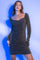woman wearing a black sparkly long sleeve bodycon dress with a square neckline and ruching details