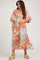 woman wearing a colorful floral maternity maxi dress with puff sleeves and a fitted bodice, holding her baby bump