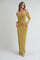 woman wearing a long olive green off-shoulder maxi dress with fitted silhouette and strappy heels