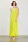 woman wearing a bright yellow maxi dress with thin straps and a flowing design