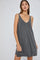 woman wearing a grey sleeveless casual dress with a deep v-neck and relaxed fit