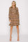 woman wearing a long sleeve brown floral shirt dress with a button-down front and flared hem