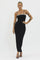 woman wearing a black sleeveless maxi dress with a drawstring detail and decorative straps