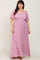 Woman wearing a pink floral smocked maxi dress with flutter sleeves and a square neckline