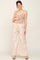 pregnant woman wearing tan maternity camisole and cream wide leg drawstring pants