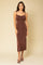 woman wearing a brown midi slip dress with cowl neck and spaghetti straps against a beige background