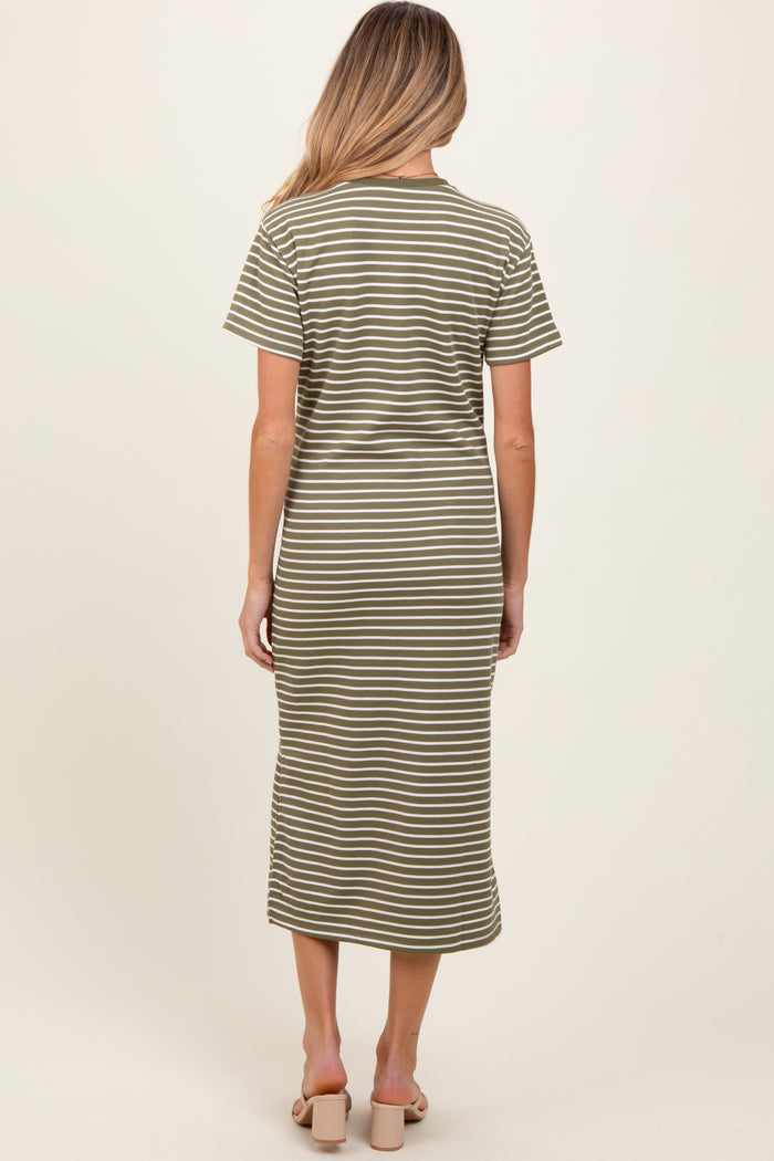 woman wearing a green and white striped maternity dress with short sleeves and a midi length, seen from the back