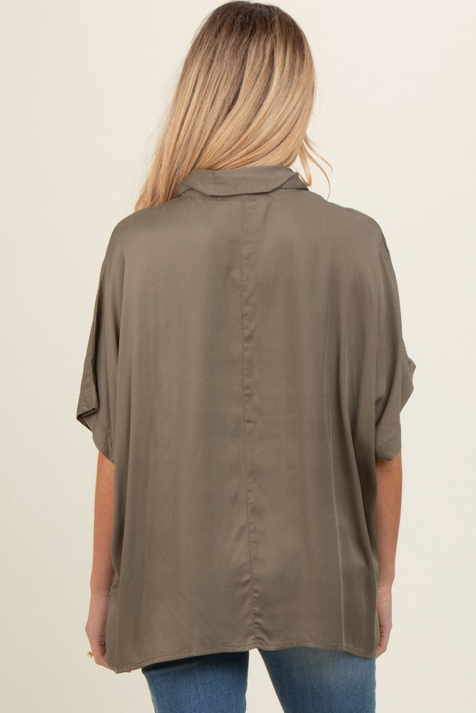 woman wearing an olive green maternity top with a loose fit and short sleeves, view from the back