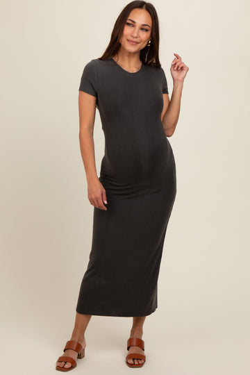 woman wearing a dark gray short sleeve maternity dress that fits over her baby bump