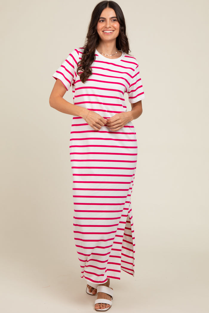 woman wearing a white and pink striped maxi dress with short sleeves and a side slit