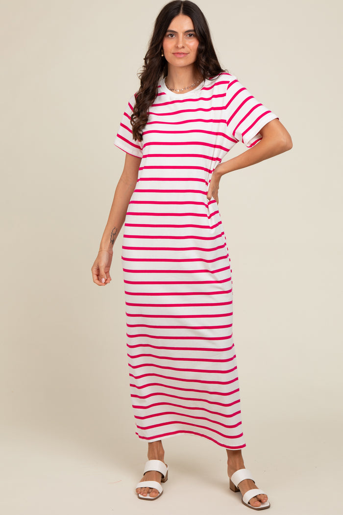woman wearing a pink and white striped maxi dress with short sleeves and a relaxed fit