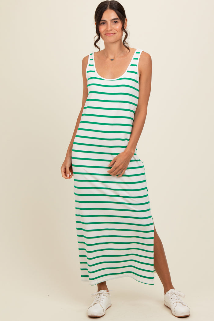woman wearing a green and white striped maxi dress with a side slit and casual white sneakers