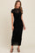 woman wearing a black floral lace maxi dress with short sleeves and a fitted silhouette
