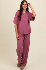woman wearing a mauve oversized short sleeve t-shirt and matching wide-leg pants