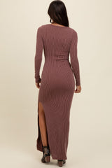 woman wearing a mauve ribbed maxi dress with long sleeves and a high side slit, viewed from the back