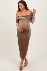 woman wearing a ribbed off-the-shoulder maternity dress in beige, showcasing her baby bump