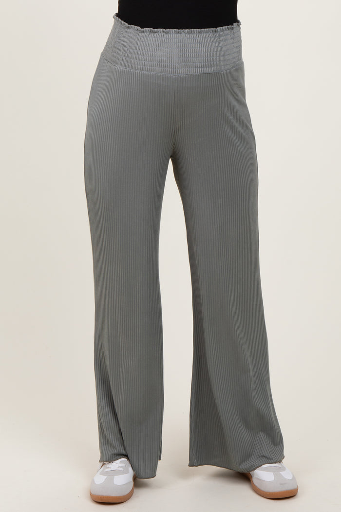 woman wearing light gray maternity wide-leg pants with a smocked waistband and ribbed texture