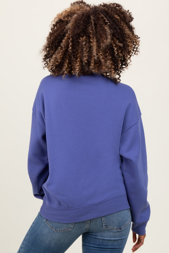 woman wearing a purple maternity sweatshirt with a relaxed fit and long sleeves, showing the back view