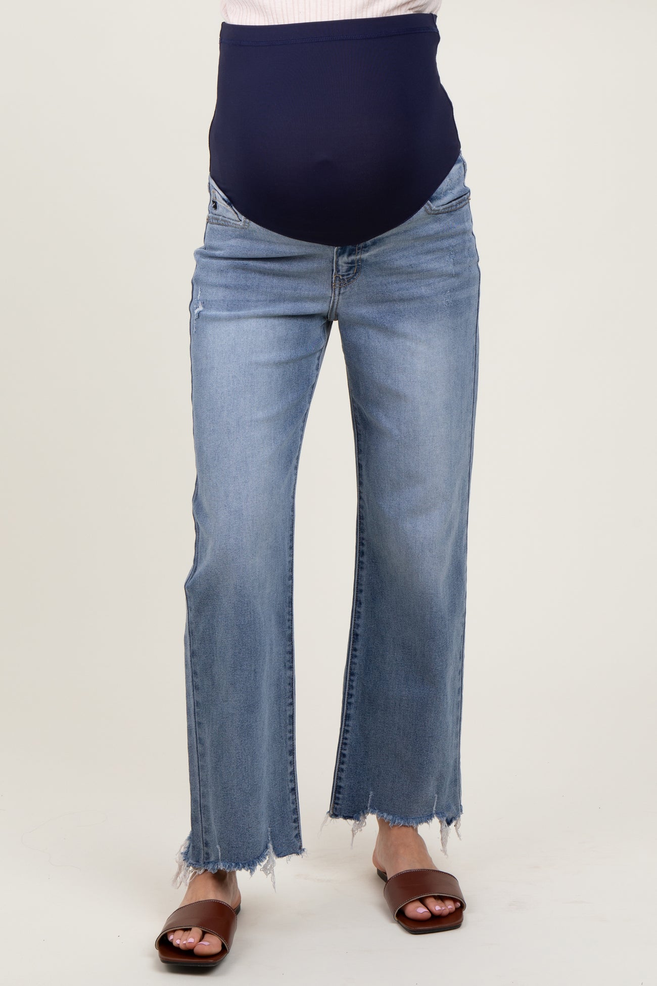 maternity wear light blue distressed wide-leg jeans with a stretchy navy maternity waistband