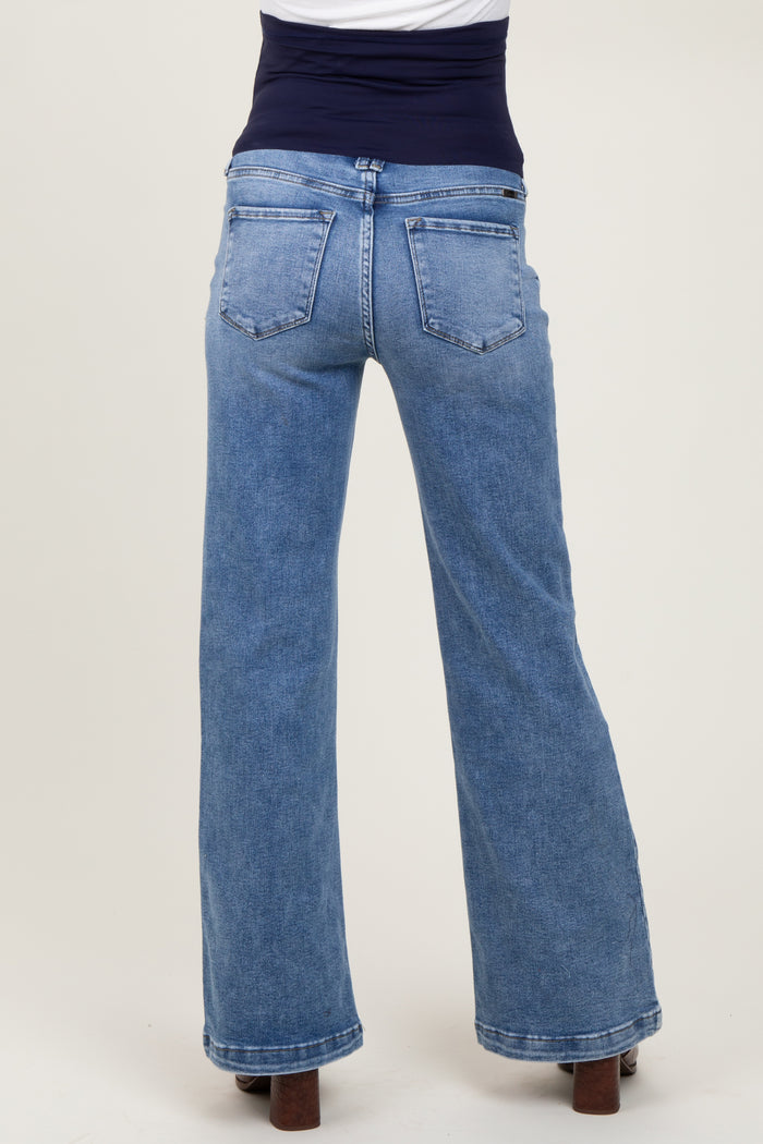 woman wearing light blue maternity wide-leg jeans with a supportive waistband, back view