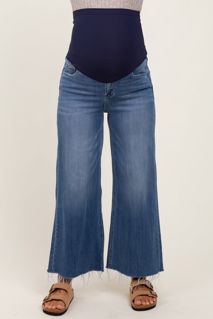 woman wearing light blue maternity wide-leg jeans with a dark blue over-the-bump band