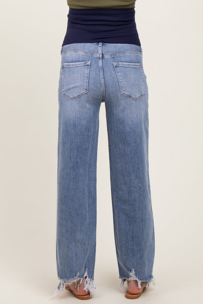 woman wearing light blue maternity wide-leg jeans with frayed hems, showing the back view