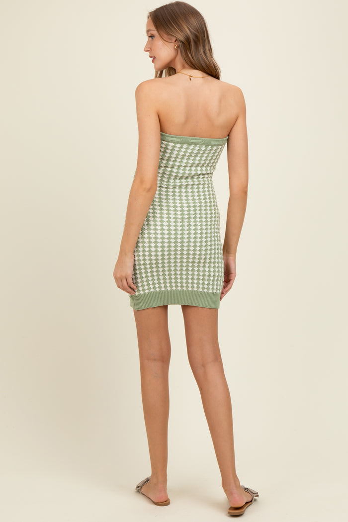 woman wearing a green and white checkered strapless knit maternity dress