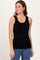 woman wearing a black ribbed sleeveless top paired with blue jeans