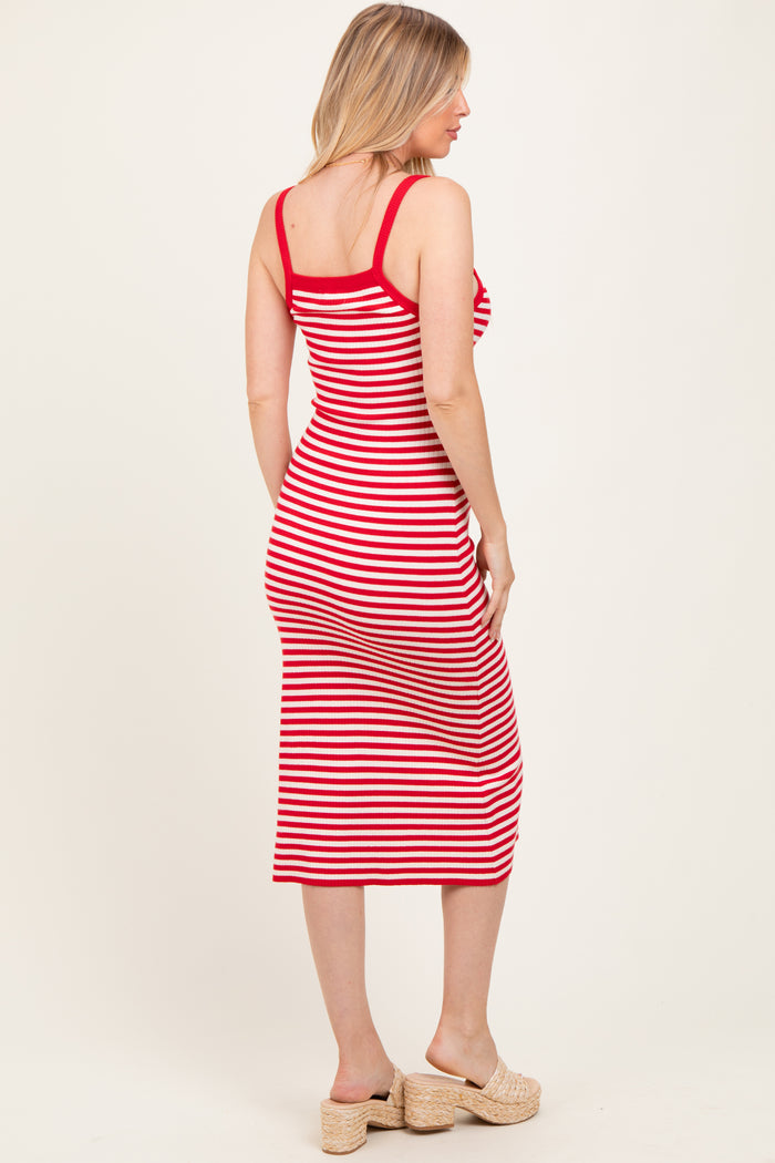 woman wearing a red and white striped maternity dress with a fitted silhouette and mid-calf length
