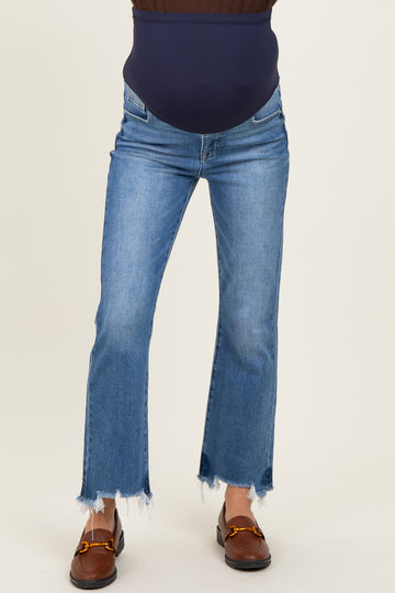 woman wearing a dark blue maternity belly support jeans with frayed hem and light blue wash