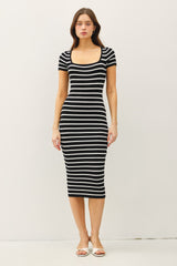 woman wearing a black and white striped short sleeve bodycon dress with a square neckline