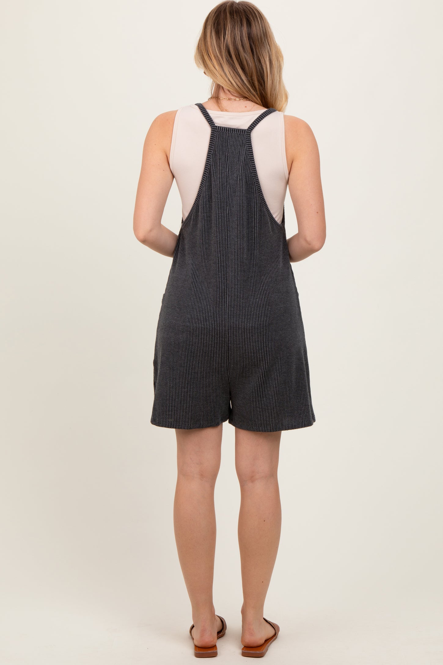 Black Solid Ribbed V-Neck Sleeveless Front Pocket Romper