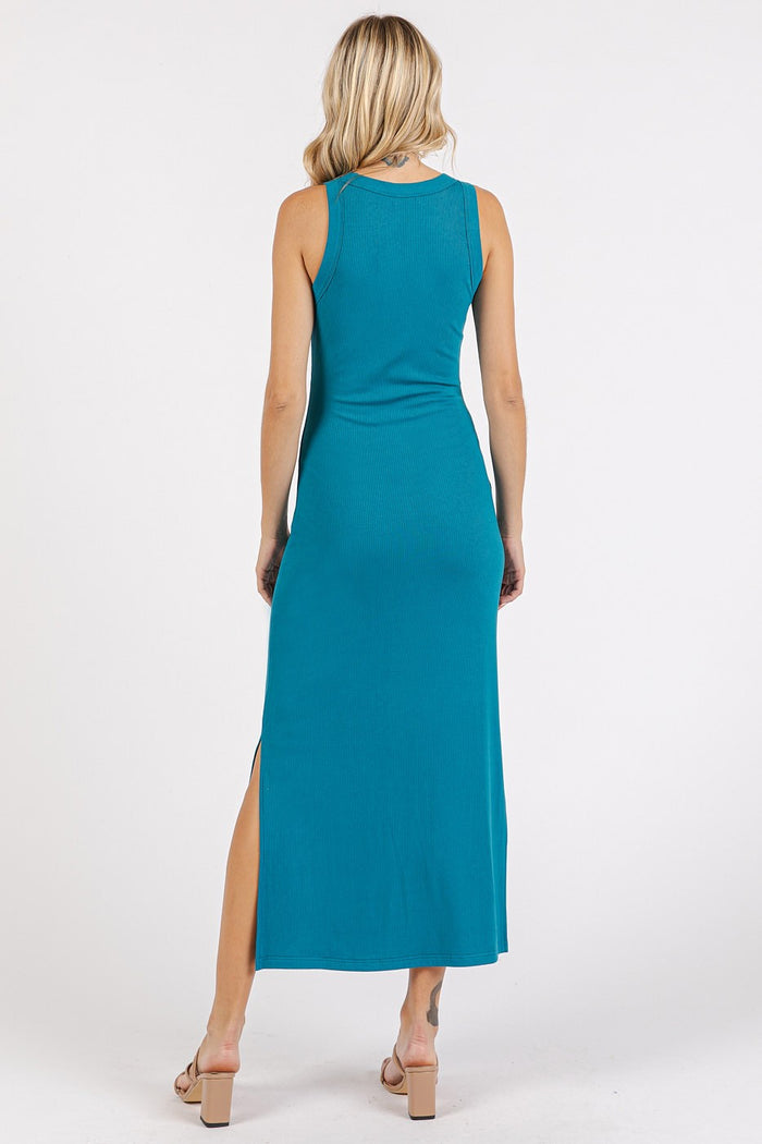 woman wearing a teal sleeveless maxi dress with a side slit, shown from the back
